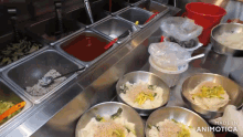 a bunch of bowls of food on a counter with the words made in animatica