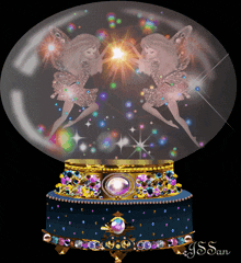 a snow globe with two fairies inside of it and the name j.s. san on the bottom