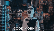 a man in a clown costume says good morning in a store