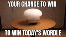 a white ball is sitting on a wooden table .