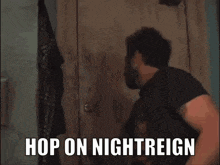 a man standing in a messy room with the words hop on nightreign