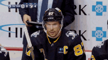 a hockey player wearing a jersey with the number 8 on it