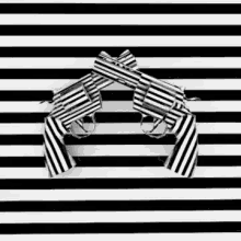 two guns are crossed over each other on a striped background .