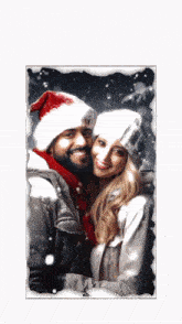 a man and woman wearing santa hats are posing for a picture in the snow