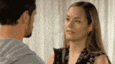 a man and a woman are looking at each other with their eyes closed