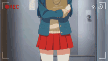 a girl in a blue jacket and red skirt is holding a book that says " happy to share "