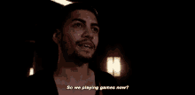 a man with a beard is talking to another man in a dark room and says `` so we playing games now ? ''
