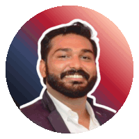 a man with a beard is smiling in a circle with a red and blue background