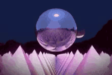 a purple flower with a blue ball in the middle of it