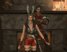 a man and a woman are standing in front of a fireplace with hearts coming out of them