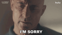 a man says " i 'm sorry " in front of a hulu logo