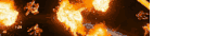 a blurred image of a fire burning in a dark room