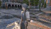 a person in a video game is standing on a brick sidewalk