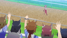 a group of people watching a race with the word meta on the fence