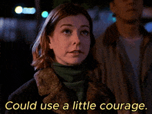 a woman in a fur coat with the words could use a little courage