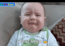 a baby is crying with the words i 'm scared on the bottom