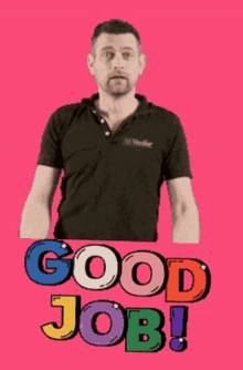 a man in a black shirt is standing in front of a sign that says good job
