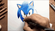 a person is drawing sonic the hedgehog on a piece of paper made in animatica