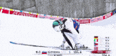 a ski racer is going down a snowy slope sponsored by generali