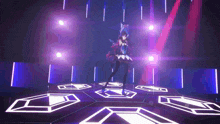 a girl is dancing on a stage with purple lights