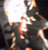 a blurry picture of a person 's face with a white glow in the middle