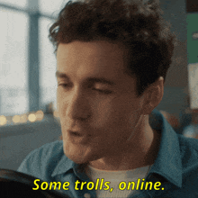 a man says " some trolls online " in yellow letters