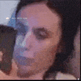 a close up of a woman 's face with the words made with pika visible