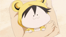 a cartoon character wearing a yellow bear hood