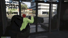 a man in a green shirt is standing in front of a sliding glass door in a video game ..