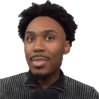 a man with a beard is wearing a striped shirt and holding a black microphone