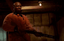 a man holding a shotgun with the words no man i 'm pretty fucking far from ok on the bottom