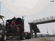 a girl with green hair is standing in front of a red semi truck with the number 9973 on the screen
