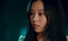 a close up of a woman 's face with her eyes closed and her mouth open .
