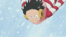 monkey d luffy from one piece is flying through the air while wearing a striped outfit and gloves .