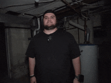 a man is giving a thumbs up in front of a water heater