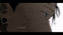 a close up of a person 's face with the name nsnlxd on the bottom left