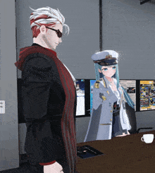 a man and a girl are standing next to each other in front of a computer screen