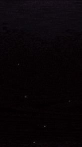 a dark background with a glowing light coming out of it
