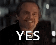 a man with a beard is smiling with the word yes written on his face .