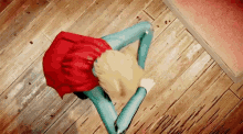 a woman in a red dress is standing on a wooden floor with her legs crossed .