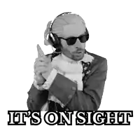 a man wearing sunglasses and headphones says it 's on sight in a black and white photo