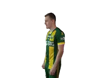 a man wearing a green and yellow jersey that says cars jeans on it