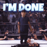 a man standing in a wrestling ring with the words " i 'm done " above him