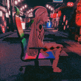 a cartoon character is sitting in a chair with a sign that says ' xx ' on it
