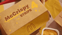a box of mcdonald 's chicken nuggets with a m on it