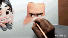 a person is drawing a cartoon character with a pencil on a piece of paper .