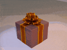 a purple gift box with a brown and gold striped bow