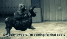 a soldier in a gas mask is kneeling down and holding a gun in a room .