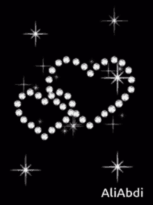 a black background with a heart made out of diamonds