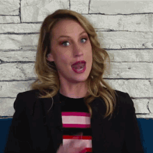 a woman making a funny face with her tongue hanging out